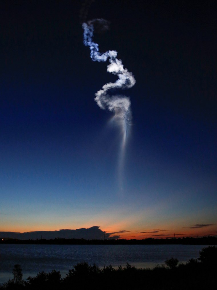 Image: The contrail of a United Launch Alliance Atlas 5 rocket is illuminated by the sun after lift off from the Cape Canaveral Air Force Station in Cape Canaveral