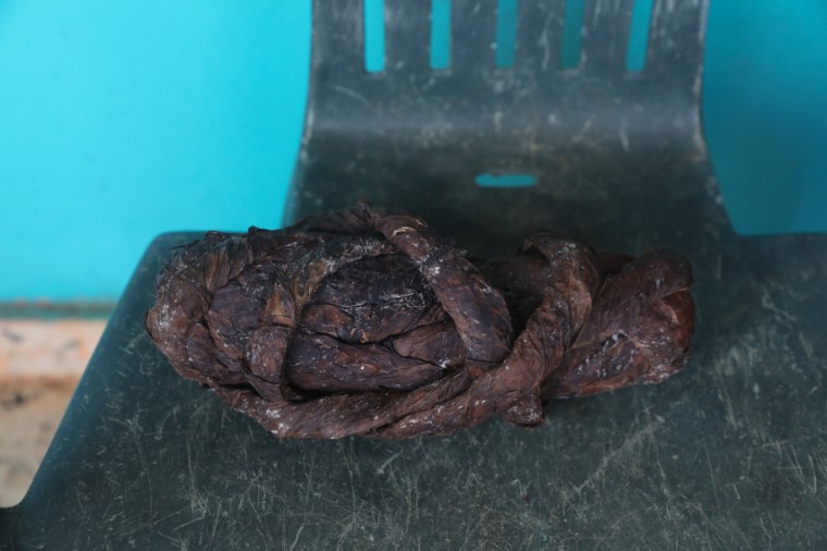 Guillermina Rosario and Jose Gonzalez sell rolls of tobacco to vendors who turn them into cigars or chewing tobacco.