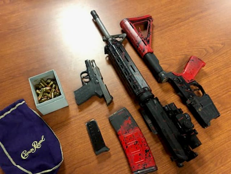 Image: Donald Reid Jr. was charged with multiple counts of possession of firearms and ammunition by a convicted felon.