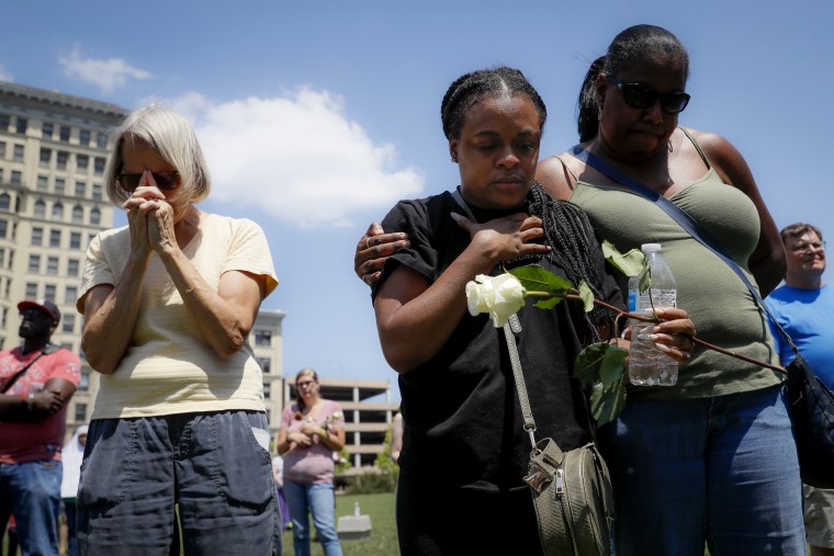 Image: Mourners gather at a vigil following a nearby mass shooting in Dayton, Ohio, on Aug. 4, 2019.
