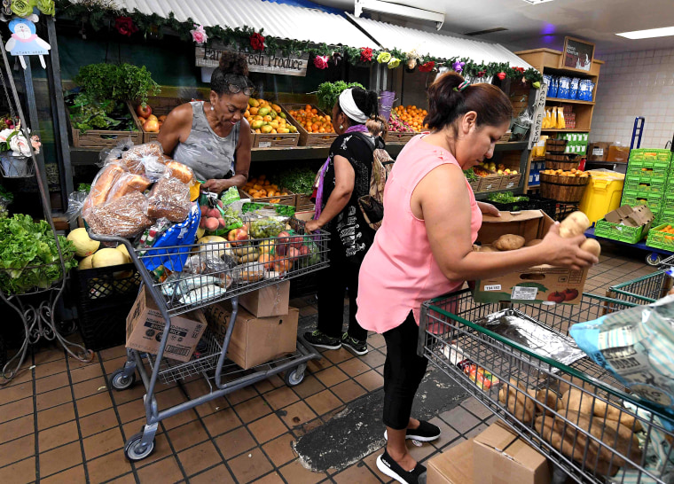 Image: People on low-incomes and retirees choose food at the World Harvest Food Bank in Los Angeles on July 24, 2019.