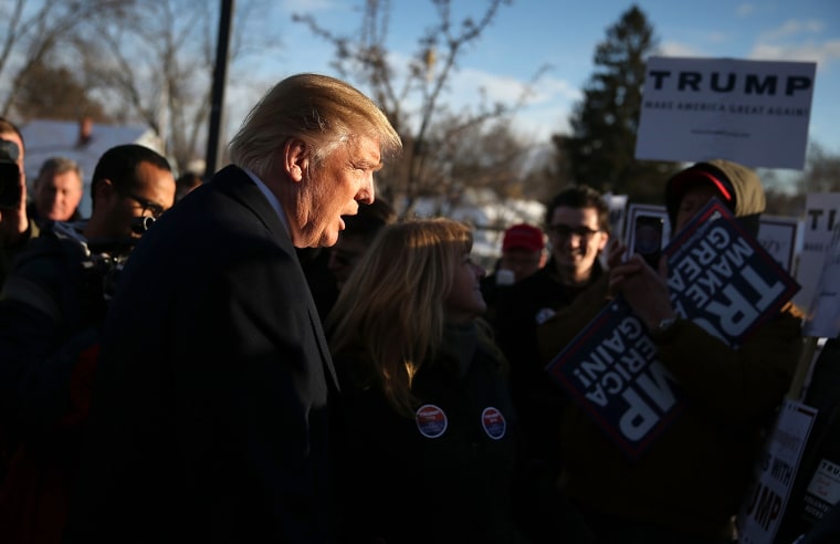 Image: Donald Trump greets supporters at a polling station in Manchester, N.H., on Feb. 9, 2016.