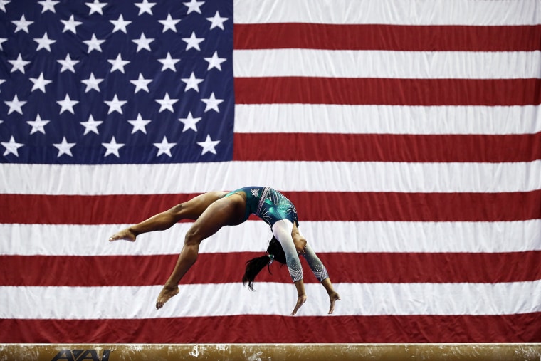 Simone Biles competes on the balance beam during the Senior Women's competition at the U.S. Gymnastics Championships in Kansas City, Missouri, on Aug. 9, 2019.