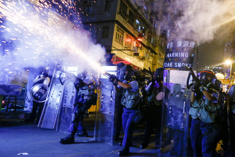 Police fire tear gas at anti-extradition bill protesters during clashes in Sham Shui Po in Hong Kong on Aug. 14, 2019.