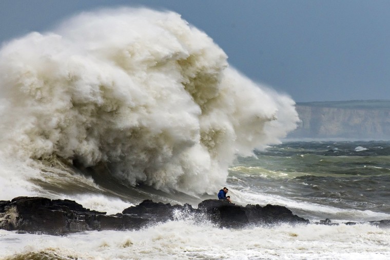 Waves crash against the harbor wall in Porthcawl, Wales. on Aug. 10, 2019.  The Met Office have issued a yellow weather warnings for winds of up to 60mph and thunderstorms for large parts of the U.K.