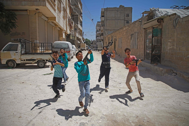 Boys play with plastic guns on the first day of the Muslim religious festival of Eid al-Adha in al-Dana in Syria's rebel-controlled Idlib region, near the border with Turkey, on Aug. 11, 2019.