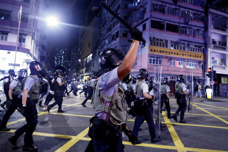 Image: FILE PHOTO: Police advance through the Sham Shui Po neighbourhood during clashes with anti-extradition bill protesters in Hong Kong