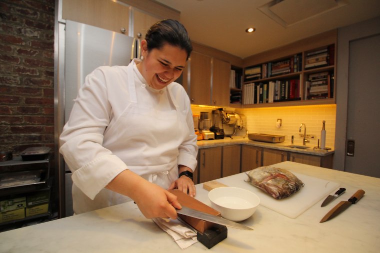 Image: Rosa Maria Molina sharpening a knife