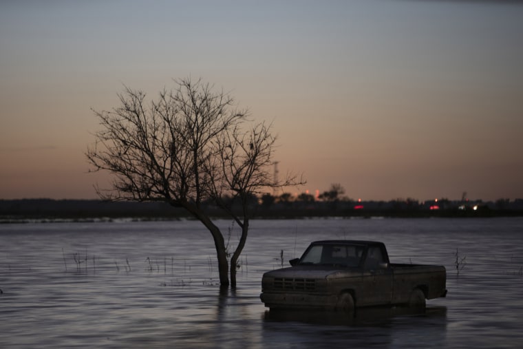 Image: A pickup truck near Bartlett, Iowa, remains submerged on August 14, 2019, by floodwaters from the Missouri River that overtook small towns and farmland in the Midwest more than five months ago.