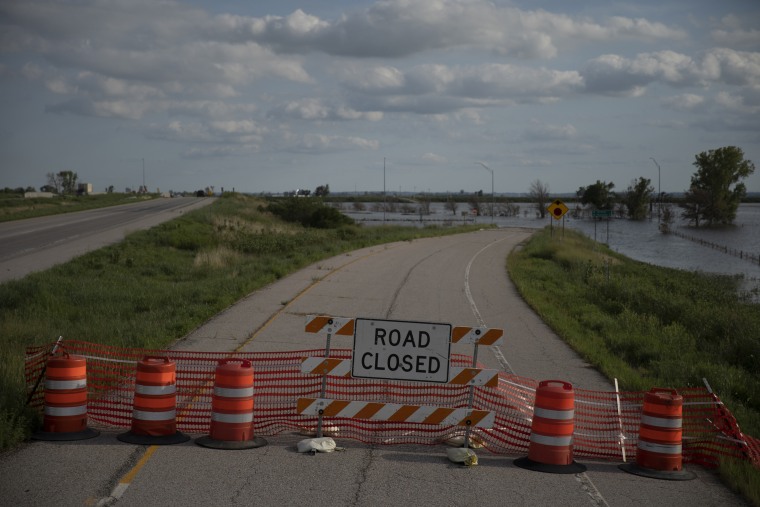 Image: An exit to the communities of McPaul and Thurman, Iowa, on August 14, 2019, remains closed more than five months after floodwaters overtook small towns and farmland along the Missouri River.