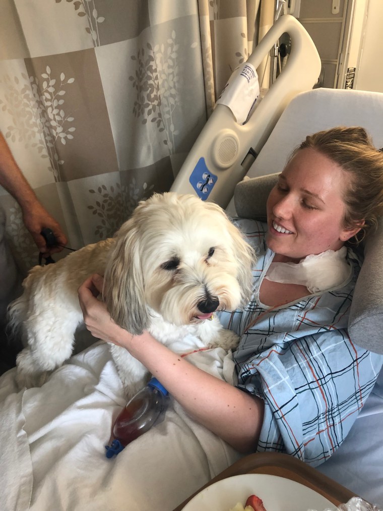 After she had her cancerous thyroid removed, Aubrie Cogan got the chance to spent time with the hospital's therapy dog, Sylus. 