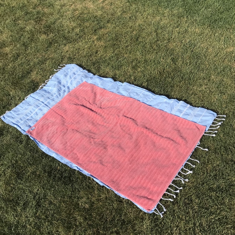 My Turkish bath towel with my old, regular bath towel on top to show the size difference