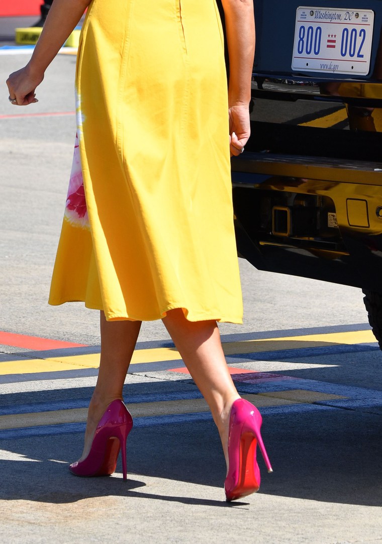 FLOTUS paired her dress with bright pinks heels that appear to be Christian Louboutin.