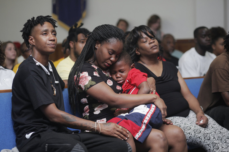 Image: Britany Jacobs, 25, consoles her 5-year-old son Markeis McGlockton Jr., during a vigil for his slain father Markeis McGlockton Sr., 28,