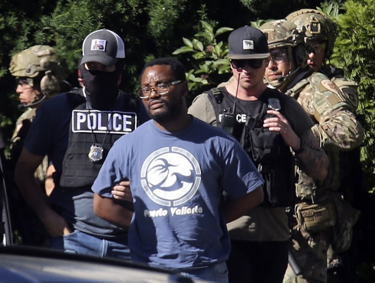 Image: Salt Lake City police take Ayoola Ajayi into custody in connection with missing University of Utah student MacKenzie Lueck