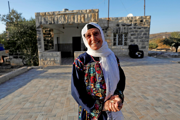 Image: Muftia, the grandmother of U.S. congresswoman Rashida Tlaib, looks on as she stands in front of her house in the village of Beit Ur Al-Fauqa in the Israeli-occupied West Bank