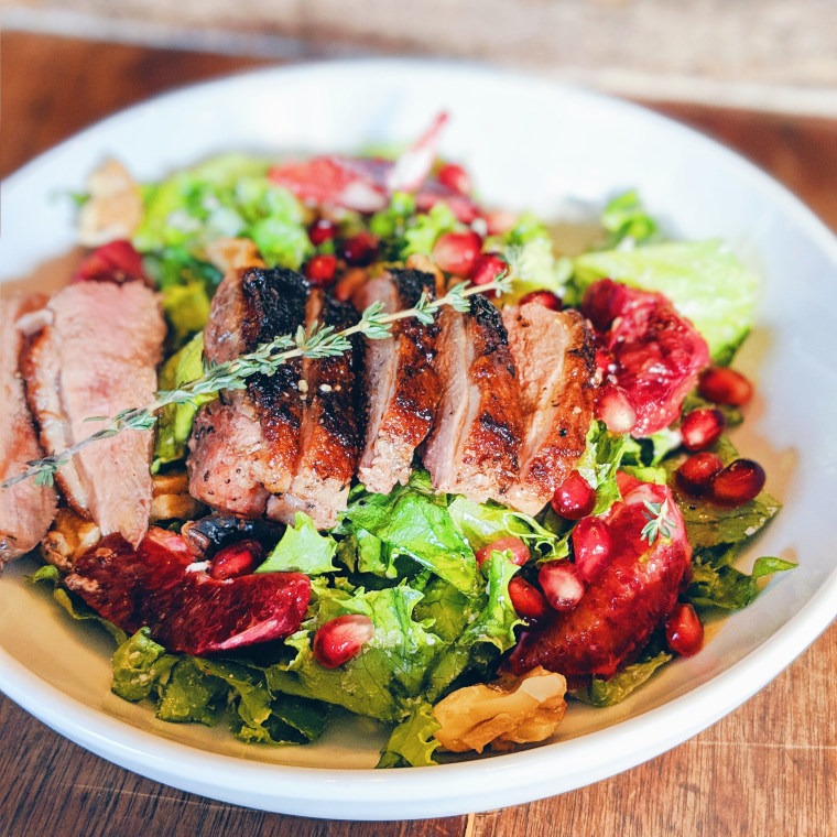 One of our fancier salads: Duck with goat cheese, blood orange segments, pomegranate seeds and walnuts