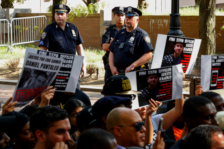 Image: New York Police Department officers stand guard at a press conference held by Gwen Carr, the mother of Eric Garner, outside of Police Headquarters in New York on Aug. 19, 2019.