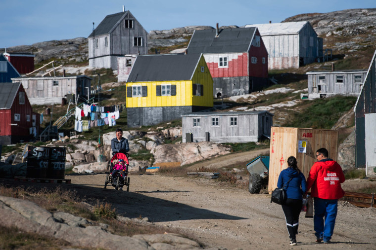 Image: Residents walk in Kulusuk, Greenland
