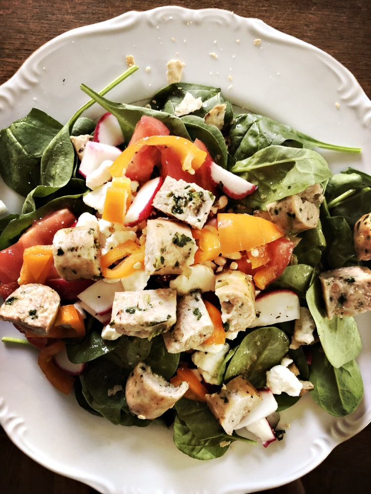 Folsom's use of leftovers: Chopped Grilled chicken and extras from the crudite tray on spinach greens for a power lunch.