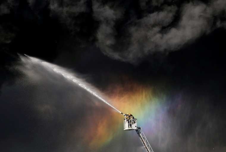 Image: Firefighters extinguish the fire at an industrial building in Saint Petersburg