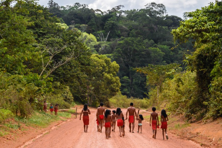 Waiapi walk on the road at Pinoty village in Amapa state in Brazil in 2017.