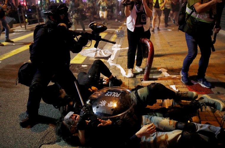 Image: Police detain a demonstrator during a protest against police violence on July 28.