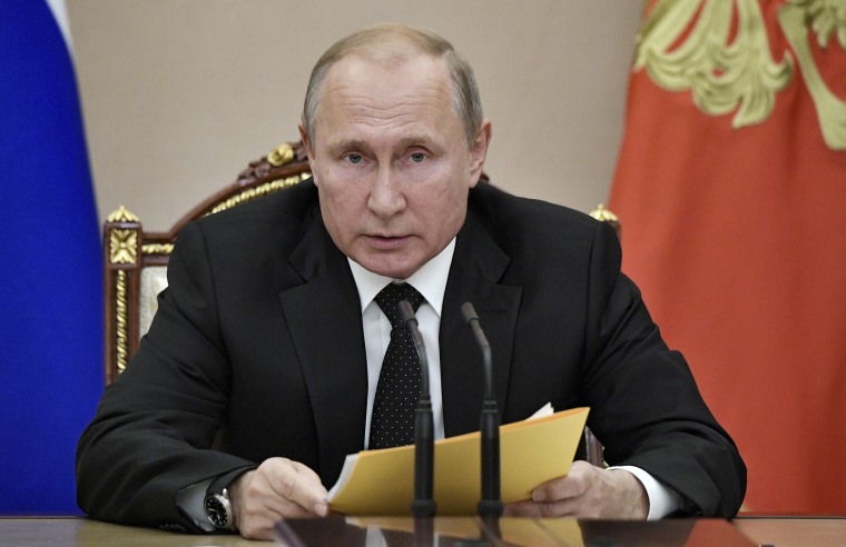 Image: Vladimir Putin speaks at a meeting with members of the Security Council in the Kremlin on Friday.