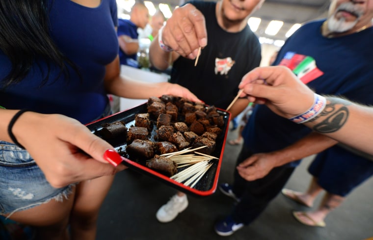 Image: Care-carrying medical marijuana patients sample the brownies