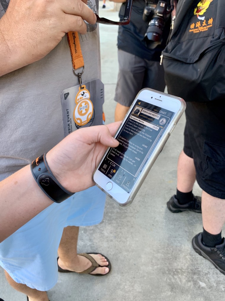 The Play Disney Parks mobile app gets a galactic makeover on Batuu, where guests can hack into droids, complete jobs for Star Wars characters and more.