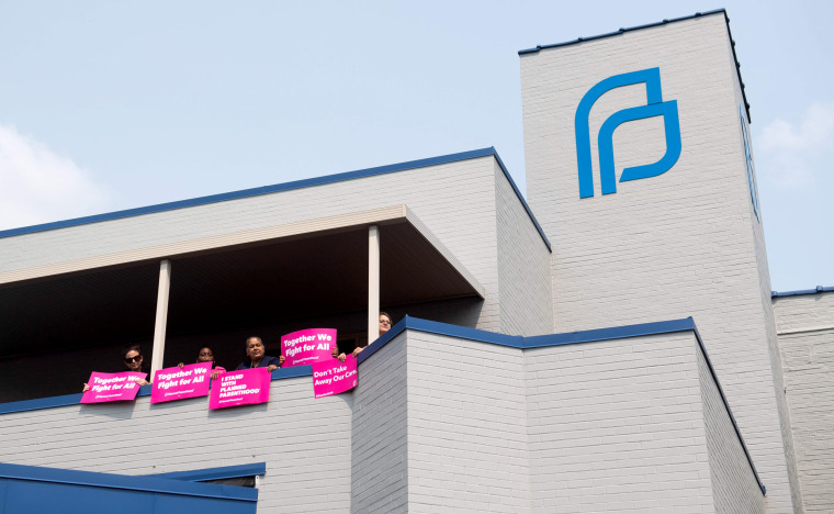 Image: Abortion rights advocates and Planned Parenthood staff hold a rally outside a clinic in St. Louis, Missouri, on May 31, 2019.