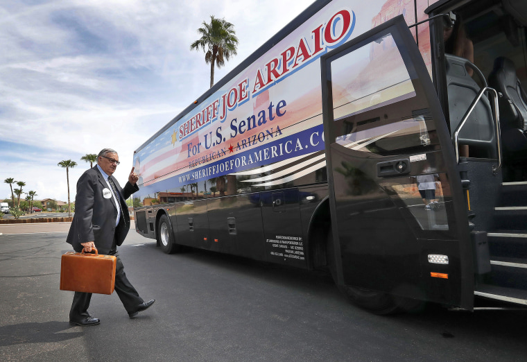 U.S. senatorial candidate and former Maricopa County Sheriff Joe Arpaio walks to his campaign tour bus on Aug. 23, 2018, in Fountain Hills, Ariz.