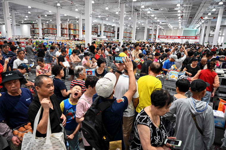 Image: People visit the first Costco outlet in China, on the stores opening day in Shanghai on Aug. 27, 2019.