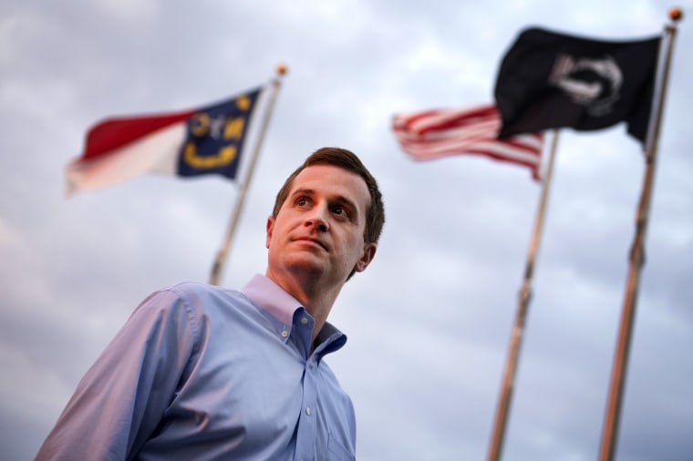 Image: Dan McCready, a Democratic candidate for North Carolina's 9th District, talks with voters in Pembroke on Aug. 10, 2019.