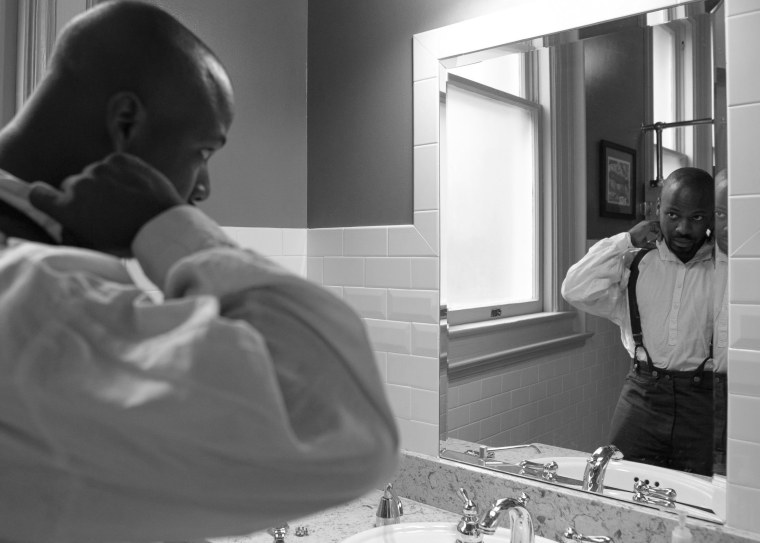 Image: Joseph Rogers gets in to costume to give voice to James Apostle Fields, his maternal ancestor and a 19th-century slave.