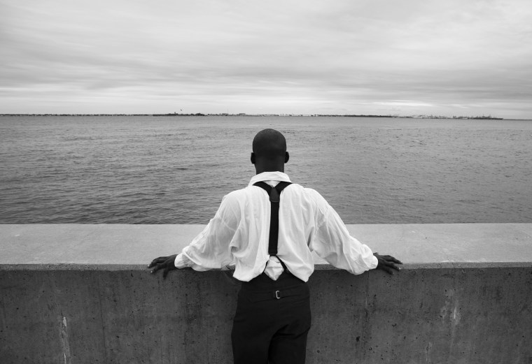 Image: Joseph Rogers looks over the water near the spot where the first enslaved Africans were brought to Virginia in 1619