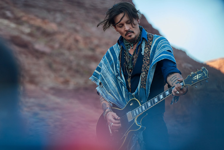 A scene featuring Johnny Depp from the Dior ad for their new perfume \"Sauvage\".