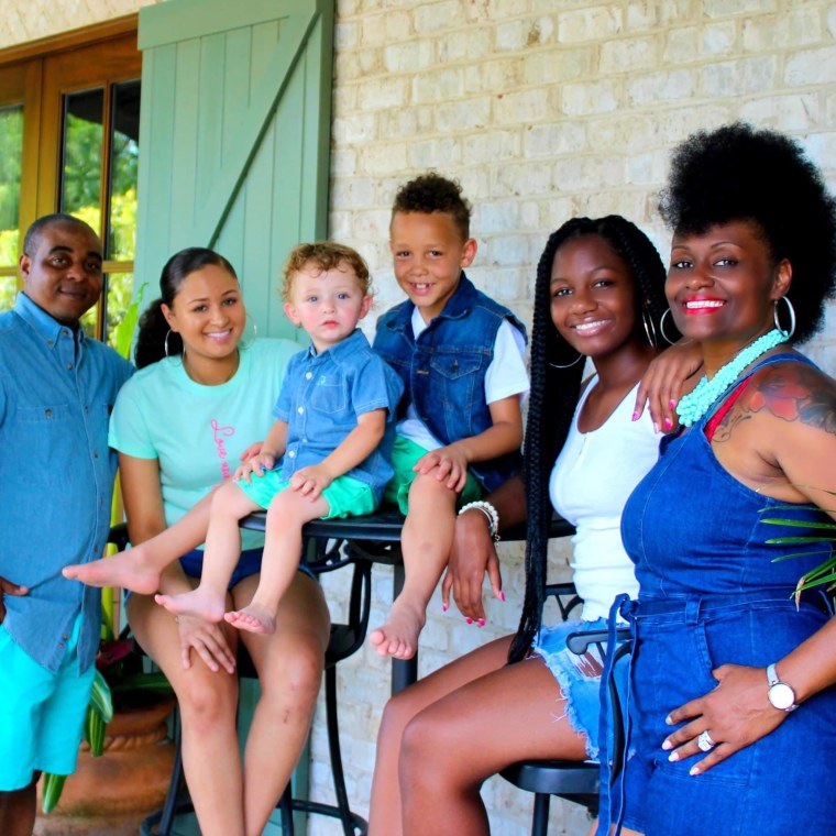 Dad Richardo Baldwin, far left, and mom Keia Jones-Baldwin, far right, are pictured with their children.