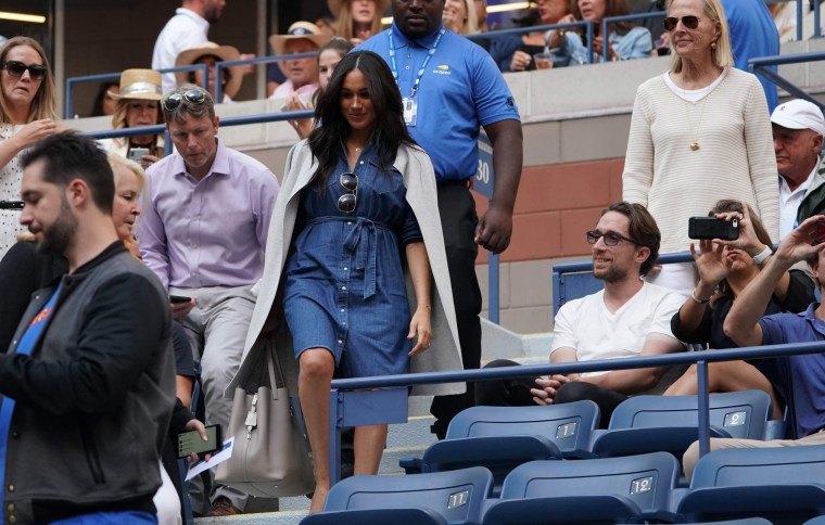The Duchess of Sussex arrives to watch her friend compete in the championship tennis match. 