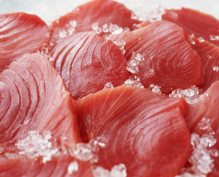 Raw sliced tuna steaks on crushed ice