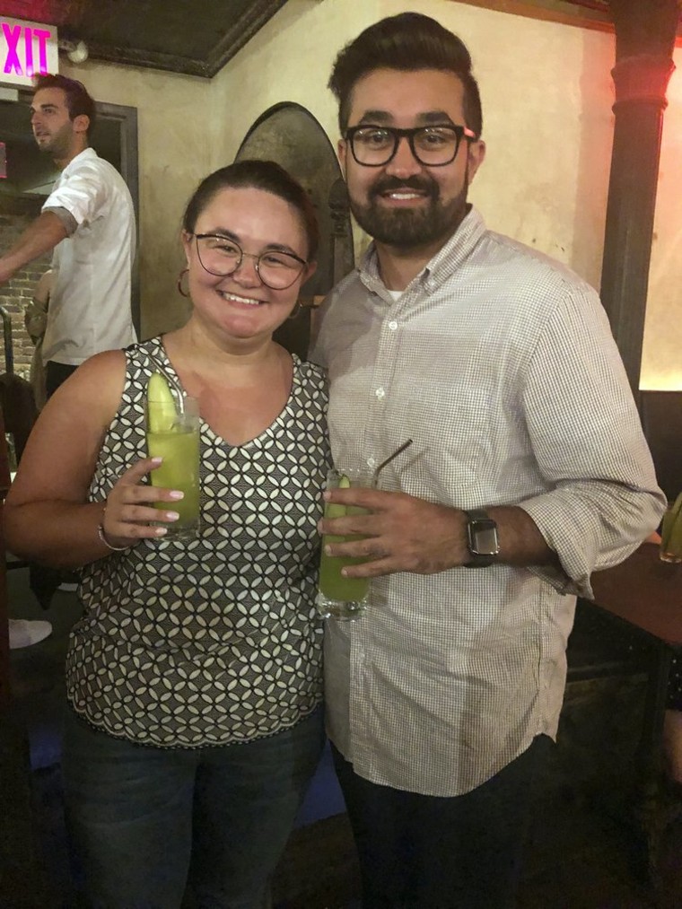 Cat Tjan, 27, of Jersey City, New Jersey, left, and Ammar Farooqi, 26, from Williamstown, New Jersey, visit Listen Bar in New York.