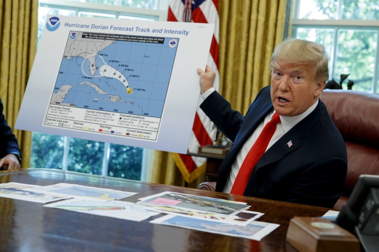 Image: President Donald Trump speaks with reporters about Hurricane Dorian in the Oval Office on Sept. 4, 2019.