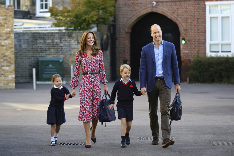 Image: Britain's Princess Charlotte, left, with her brother Prince George and their parents Prince William and Kate, Duchess of Cambridge, arrives for her first day of school at Thomas's Battersea in London,