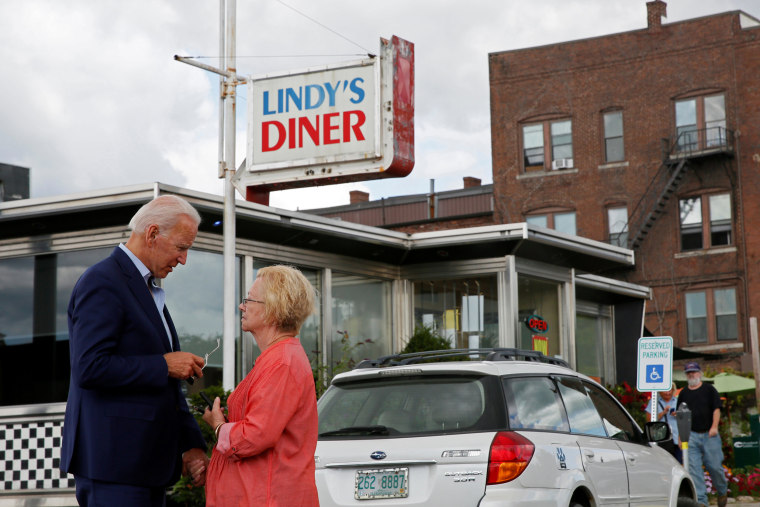 Image: Democratic 2020 U.S. presidential candidate and former Vice President Joe Biden talks with a woman outside Lindy's Diner in Keene