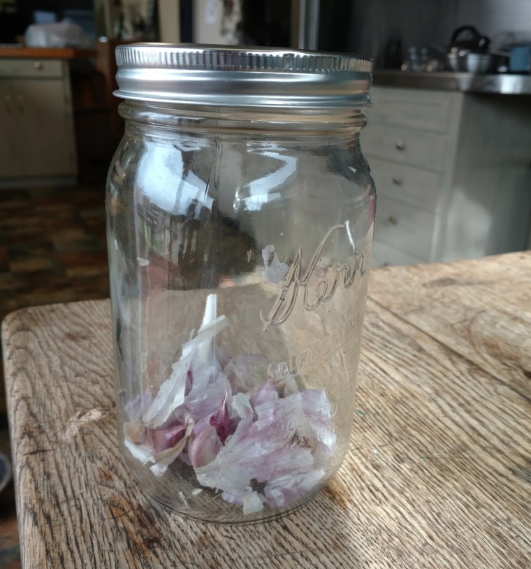 garlic skins in glass jar