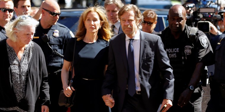 Image: Actress Felicity Huffman and husband William H. Macy arrive at the federal courthouse in Boston