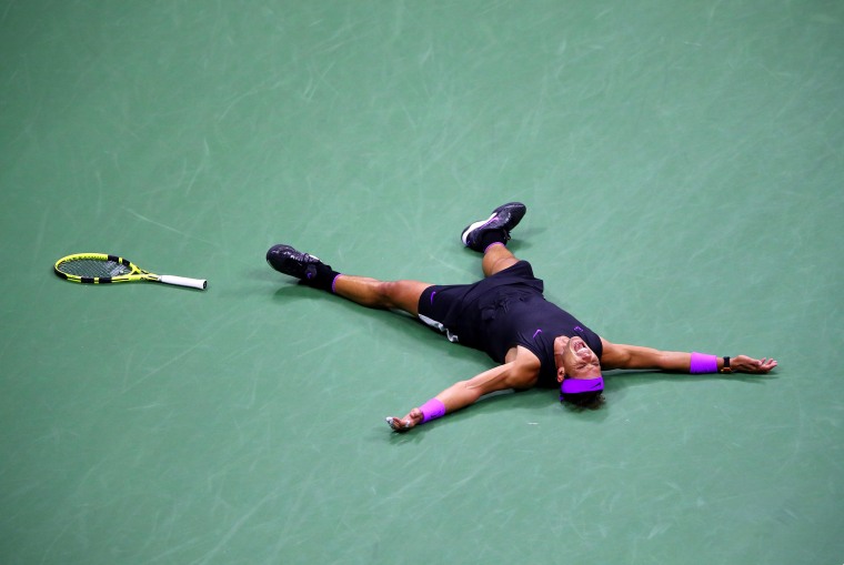 Image: Rafael Nadal of Spain celebrates match point after winning his Men's Singles final match against Daniil Medvedev
