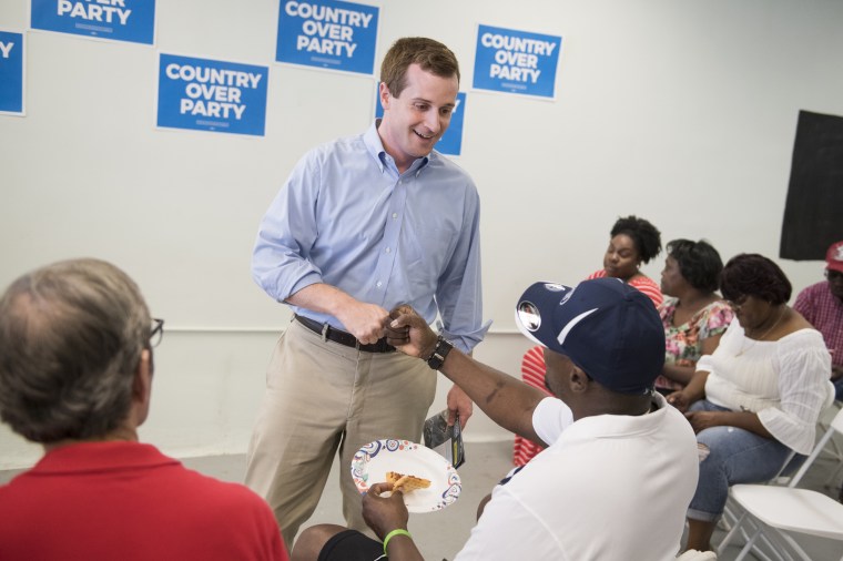 Dan McCready, Democratic candidate for North Carolina's 9th District, talks with voters at his campaign office in Elizabethtown Aug. 10, 2019. \