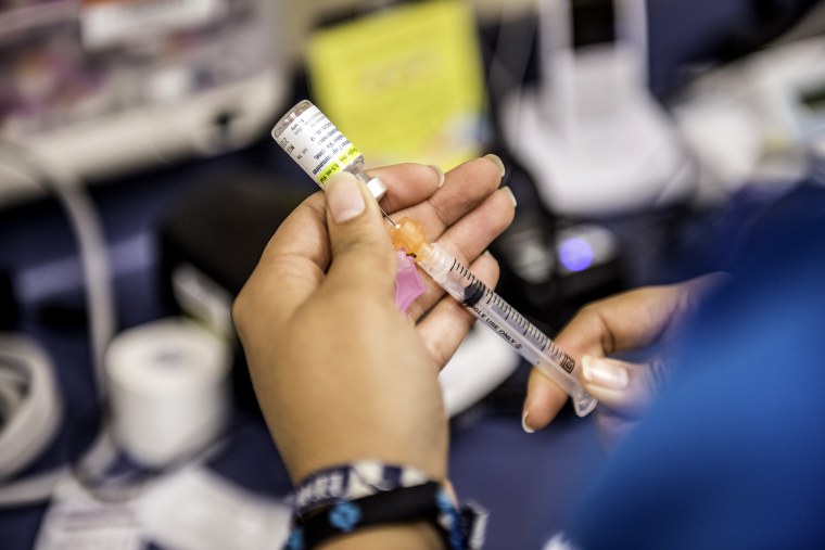Image:A medical assistant fills a needle with Gardasil, an HPV vaccination, in Texas in 2016.