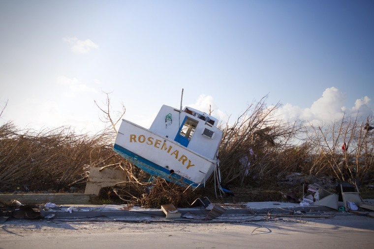 A boat is toppled over at a marina near Treasure Cay, Abaco Islands. 